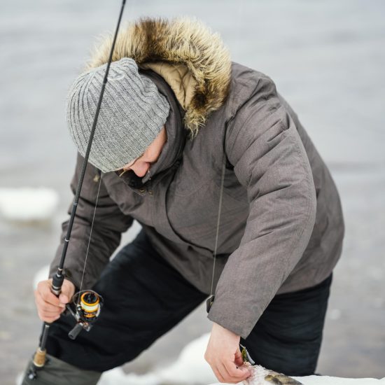 man-using-fishing-rod-catch-fish